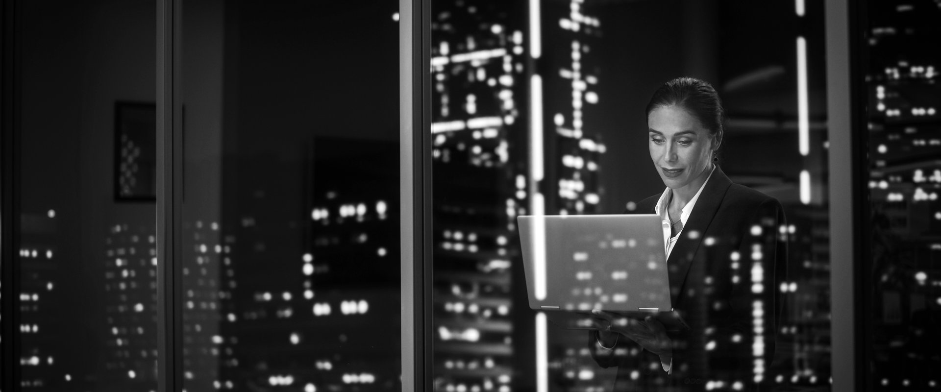 Lady with laptop behind the window